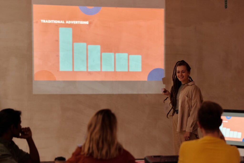 Young professional presenting data with graph in a business meeting.